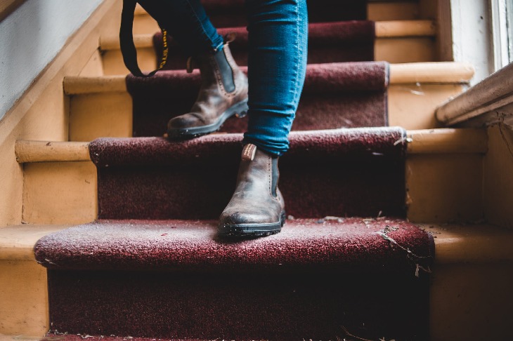 Walking down a carpeted staircase